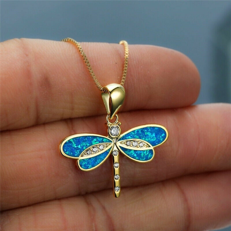 Collier papillon en or avec opale