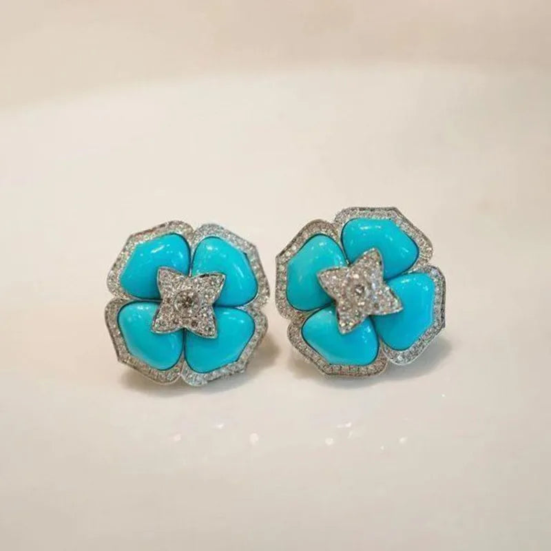 Boucles d'oreilles sophistiquées en argent bleu et fleurs