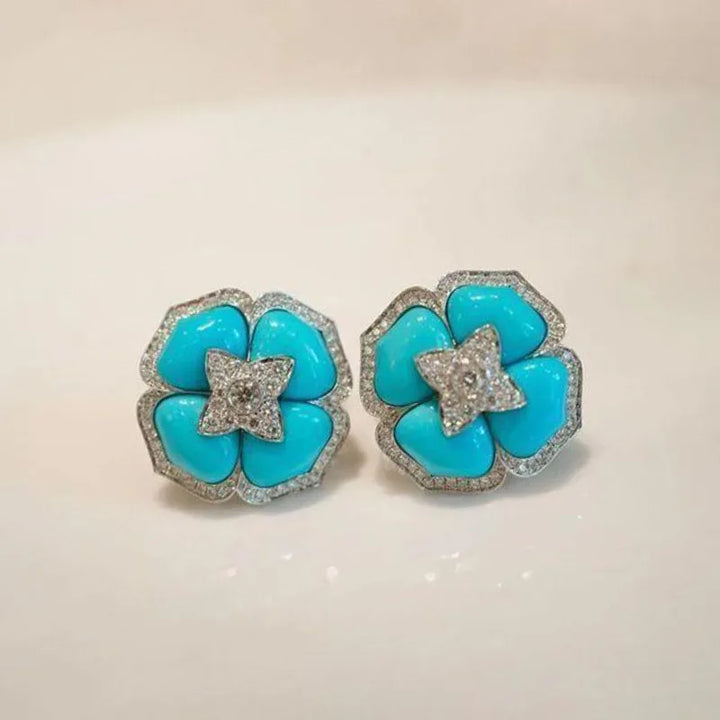 Boucles d'oreilles sophistiquées en argent bleu et fleurs