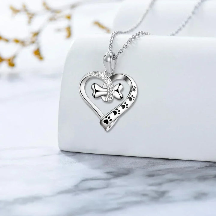 Ensemble de bijoux en 2 pièces avec des charms en forme de patte, de cœur et d'os