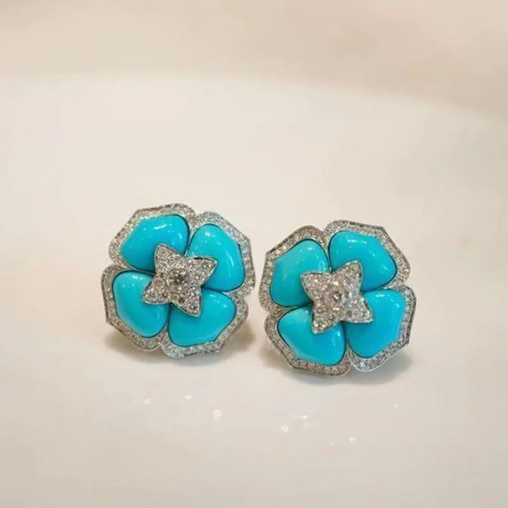 Boucles d'oreilles sophistiquées en argent bleu et fleurs