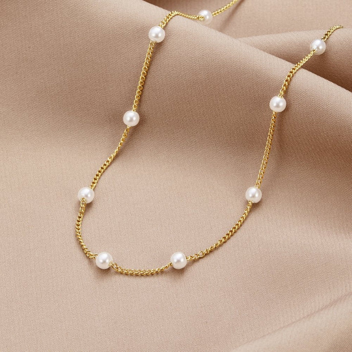 Collier en perles dorées Reine